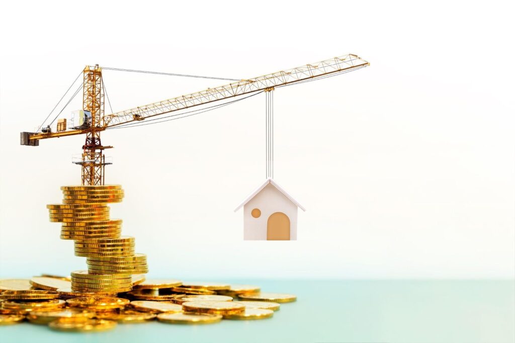 Golden coins and a house perched on a crane, symbolizing wealth and ambition