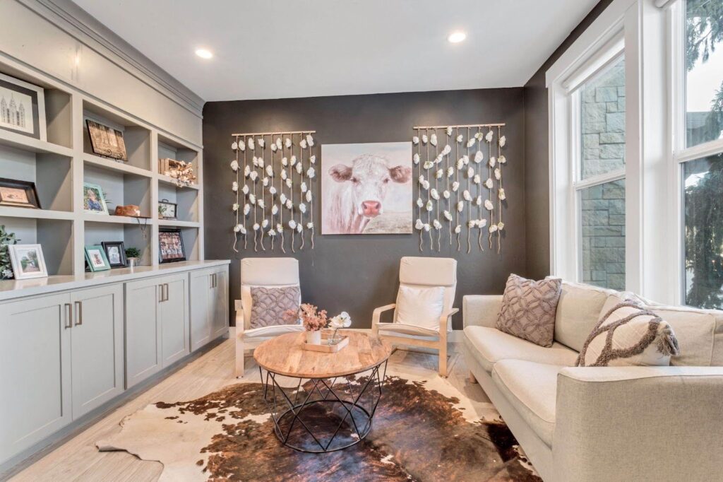 A cozy living room with a cowhide rug, adding rustic charm