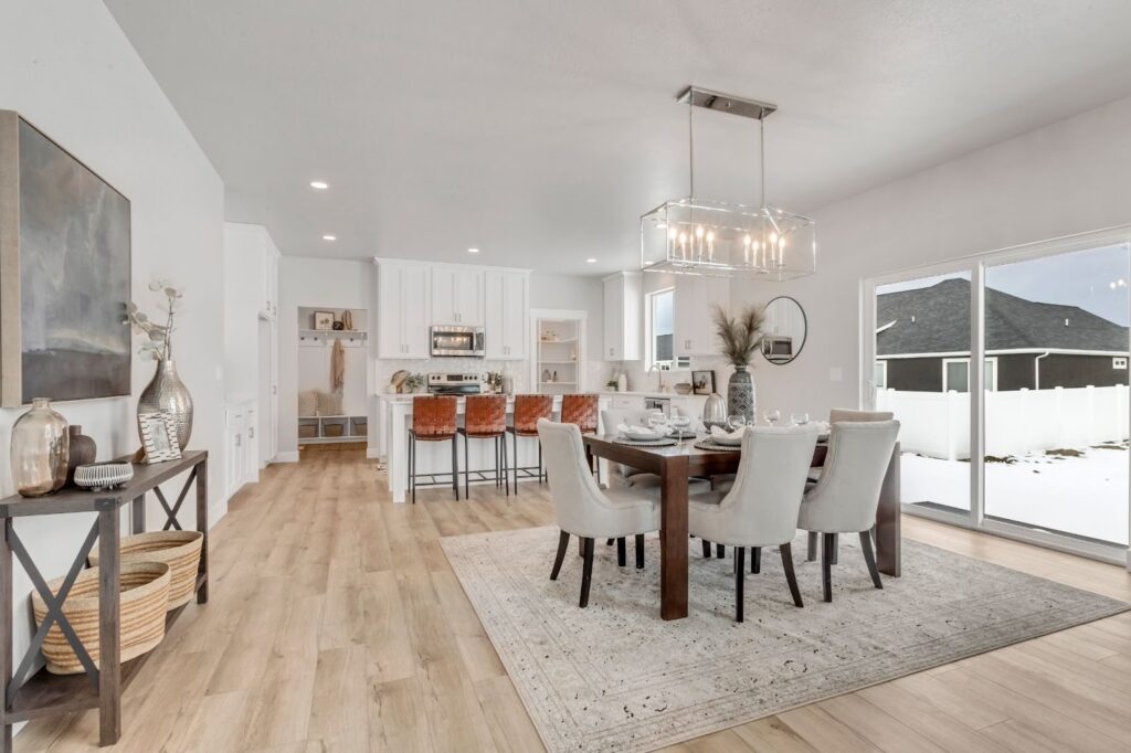 A spacious, modern kitchen and dining area in a newly constructed home, ideal for quick move-in convenience.