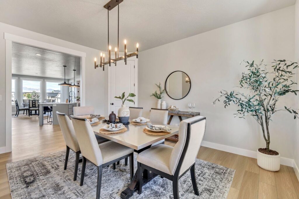 A warm dining room with a wooden table and elegant chairs