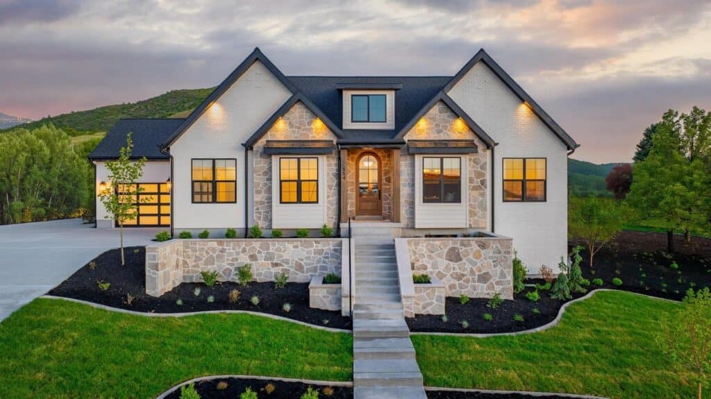 A stunning home with a stone driveway and elegant landscaping