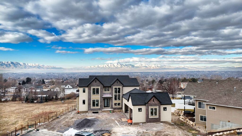 A picturesque house by Patterson Homes, featuring a stunning mountain view in the background.